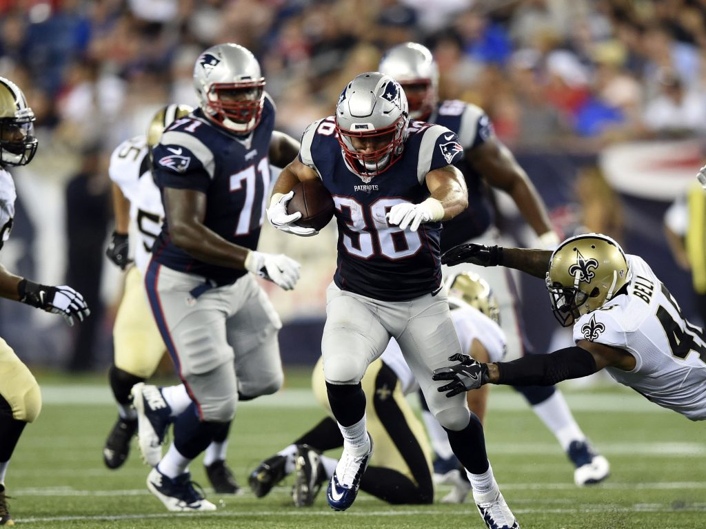 Aug 11, 2016; Foxborough, MA, USA; New England Patriots running back Tyler Gaffney (36) runs past the tackle of New Orleans Saints free safety Vonn Bell (48) for a touchdown during the second half at Gillette Stadium. Mandatory Credit: Bob DeChiara-USA TODAY Sports
